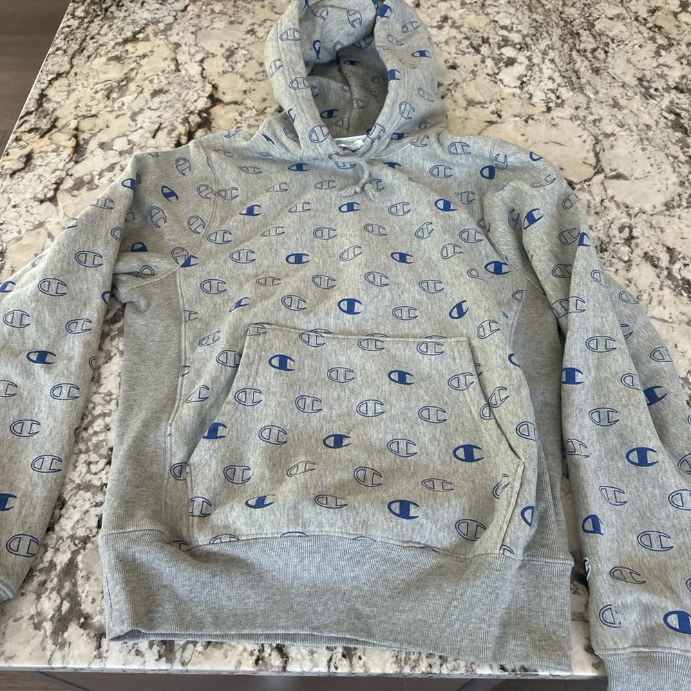 Champion Light Gray Hoodie with Blue Logo Design